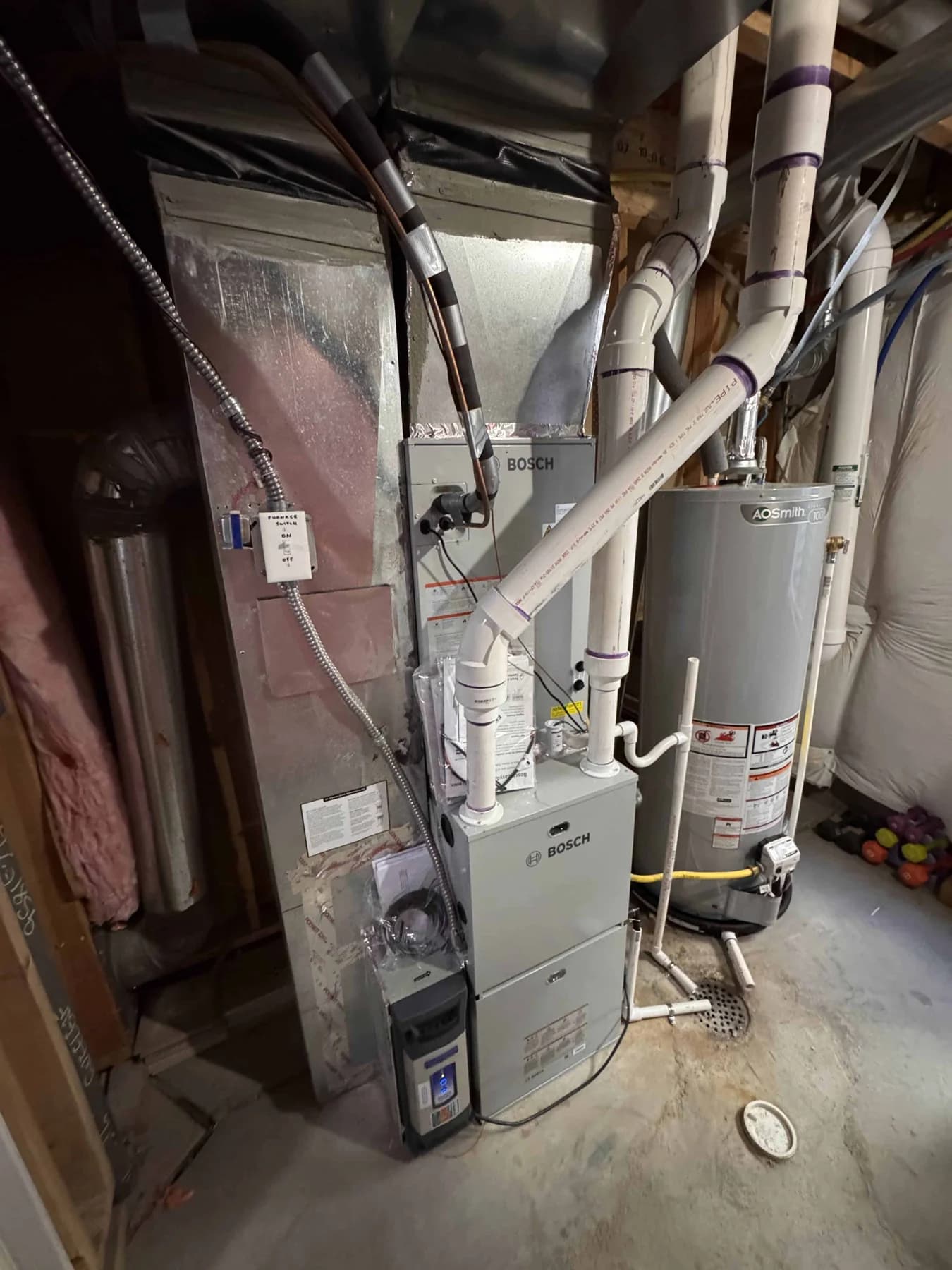 Furnace and water heater sharing a mechanical room