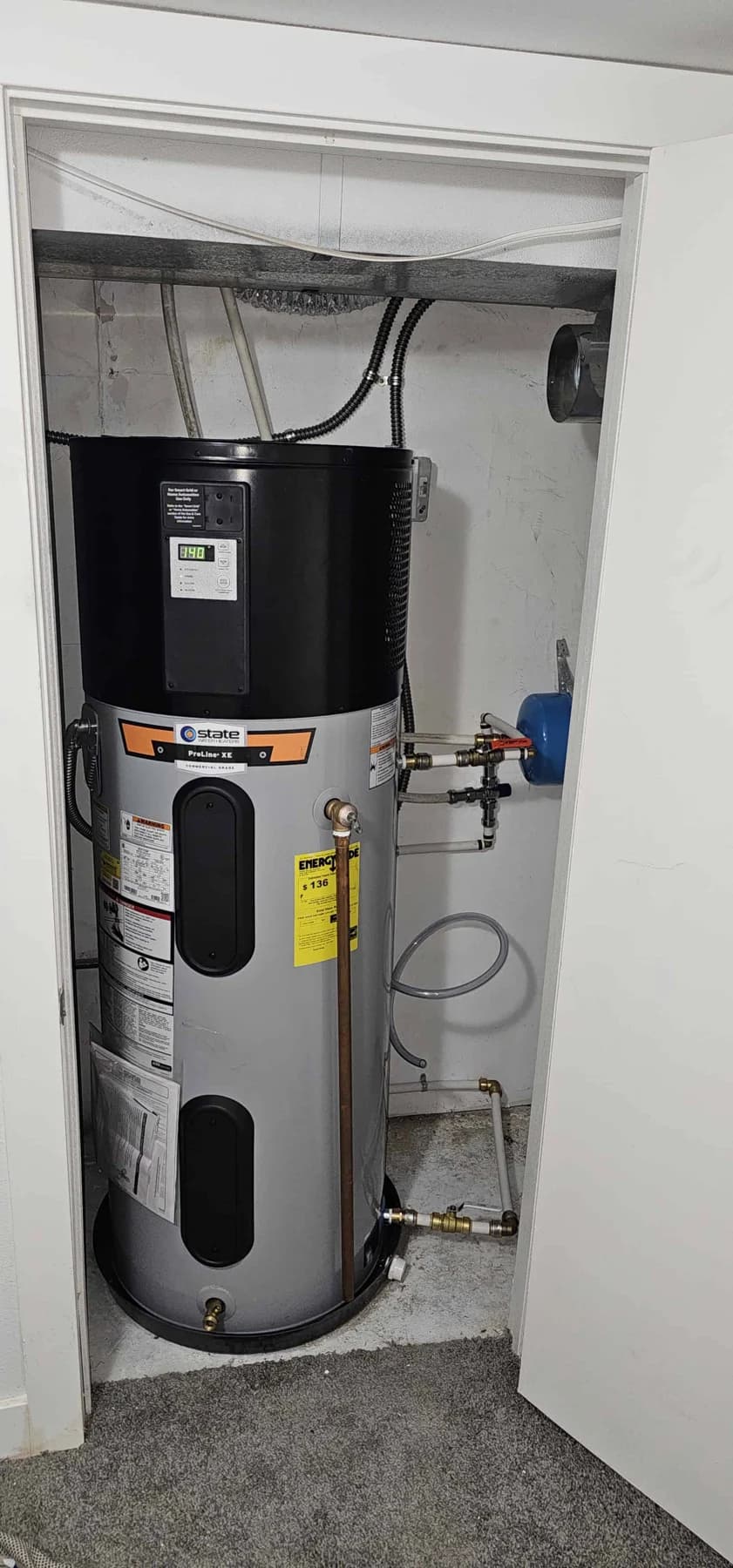 Water heater and connections inside a narrow utility closet